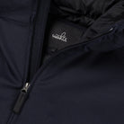 Deep navy jacket close-up: front zipper, hood lining, and WAHTS logo label