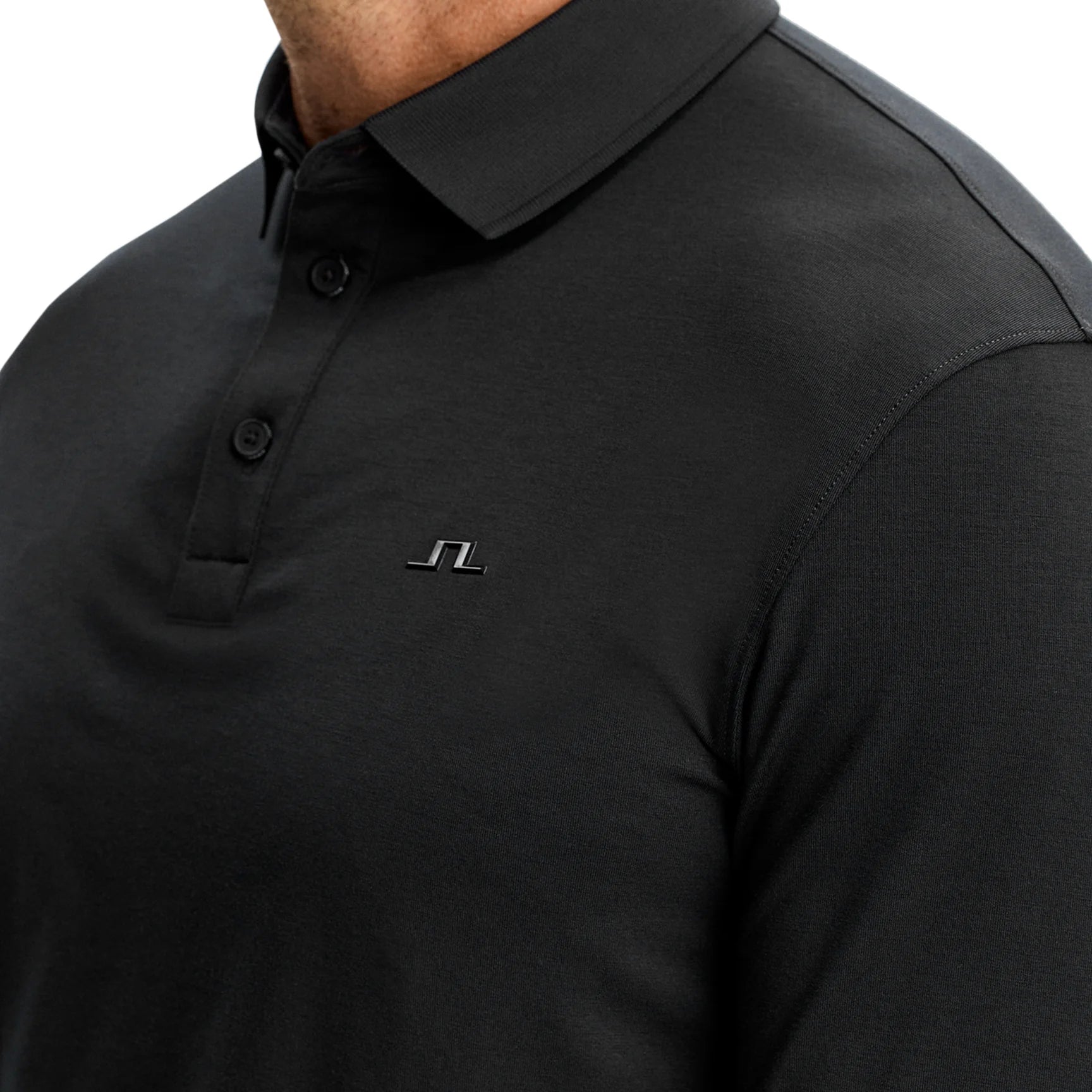 J.Lindeberg black long-sleeve polo close-up, three-button placket and chest logo