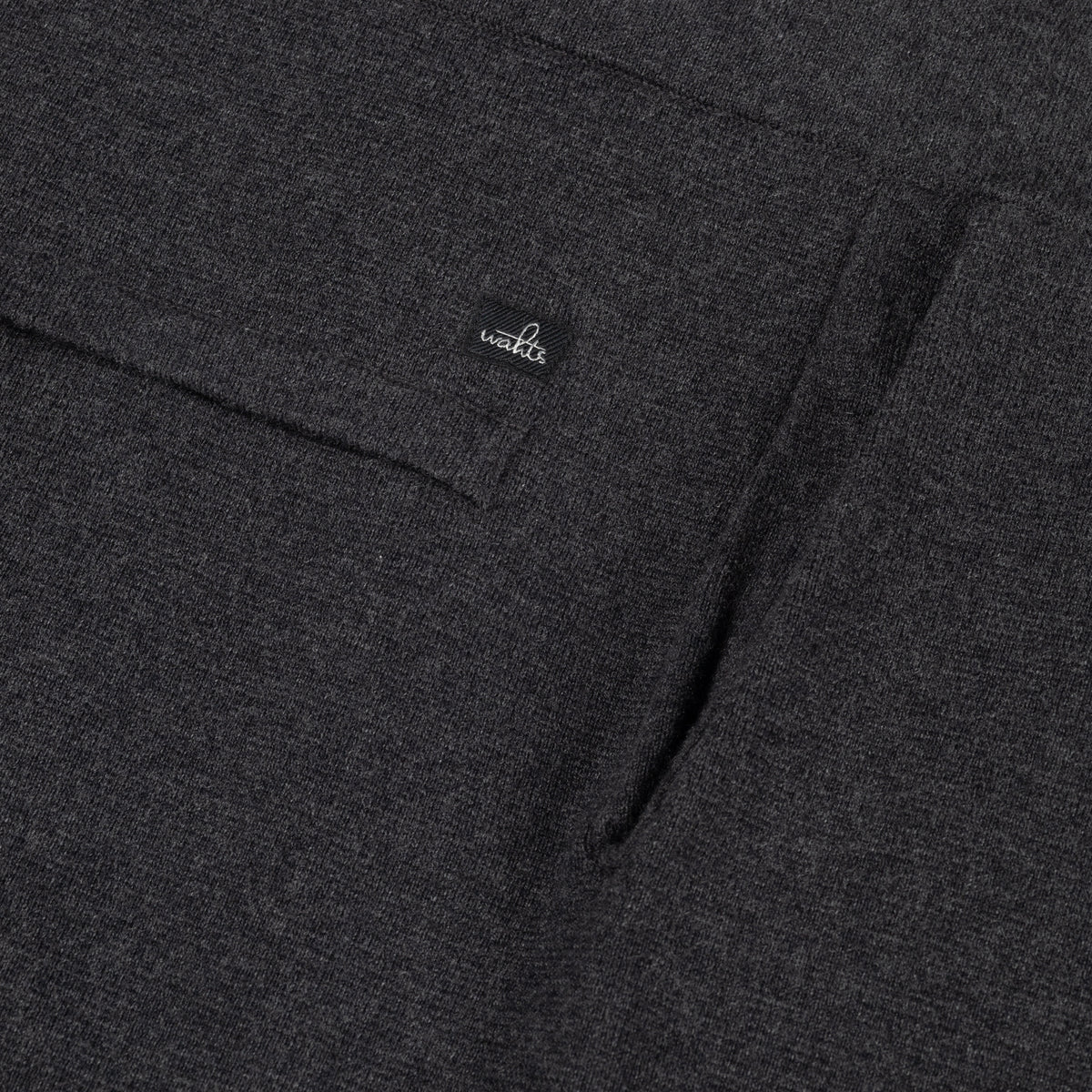 Dark melange knit lounge pants with small logo on waistband and stitched detail