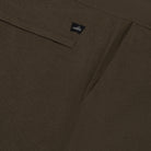 WAHTS logo label on dark olive knitted lounge pants waistband