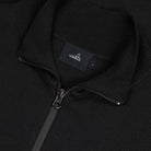 Pure black merino half-zip pullover close-up of zipper and WAHTS neck label