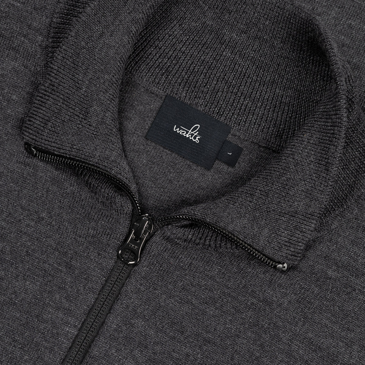 Merino half-zip pullover knit, centered zipper and WAHTS label detail