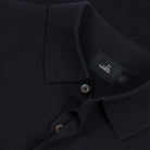 WAHTS polo shirt collar detail with button placket and woven brand tag