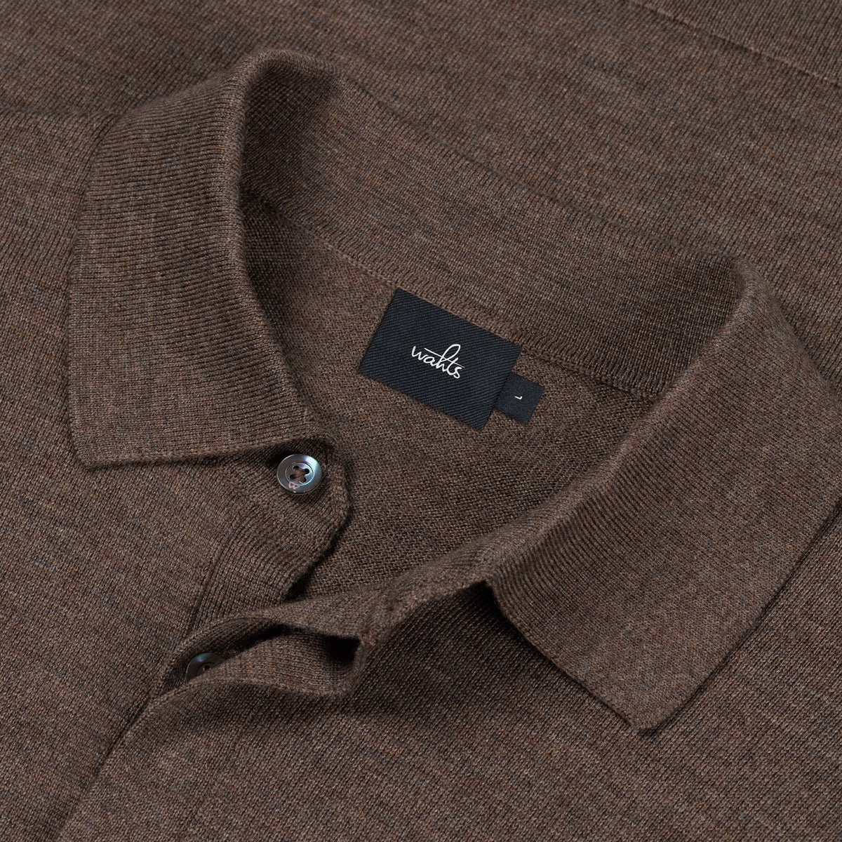 Taupe melange merino polo close-up with button placket and WAHTS neck label