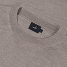 Close-up of light taupe merino crew neckline and WAHTS label tag