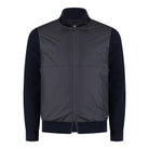 Two-tone hybrid jacket with dark navy knit sleeves, stand collar, and full zip front.