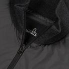 Hybrid jacket close-up: logo lining at full zip with ribbed knit trim