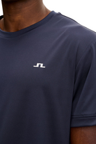 Men's navy T-shirt with small white chest logo