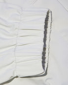 Off-white nylon bomber jacket sleeve cuff and gathered ribbed hem detail