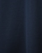 Dark navy interlock knit T-shirt fabric close-up with fine texture