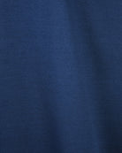 Navy blue T-shirt fabric close-up showing knit texture