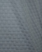 Light-blue knit fabric with raised grid texture