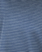 Blue knit fabric with white diagonal stripe texture