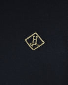 Dark blue pique polo chest monogram logo badge