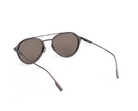 ZEGNA rounded metal sunglasses front angled view, matt gunmetal frame, dark brown lenses