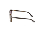 Rounded acetate sunglasses in coloured Havana, side view with dark lenses and tapered arms