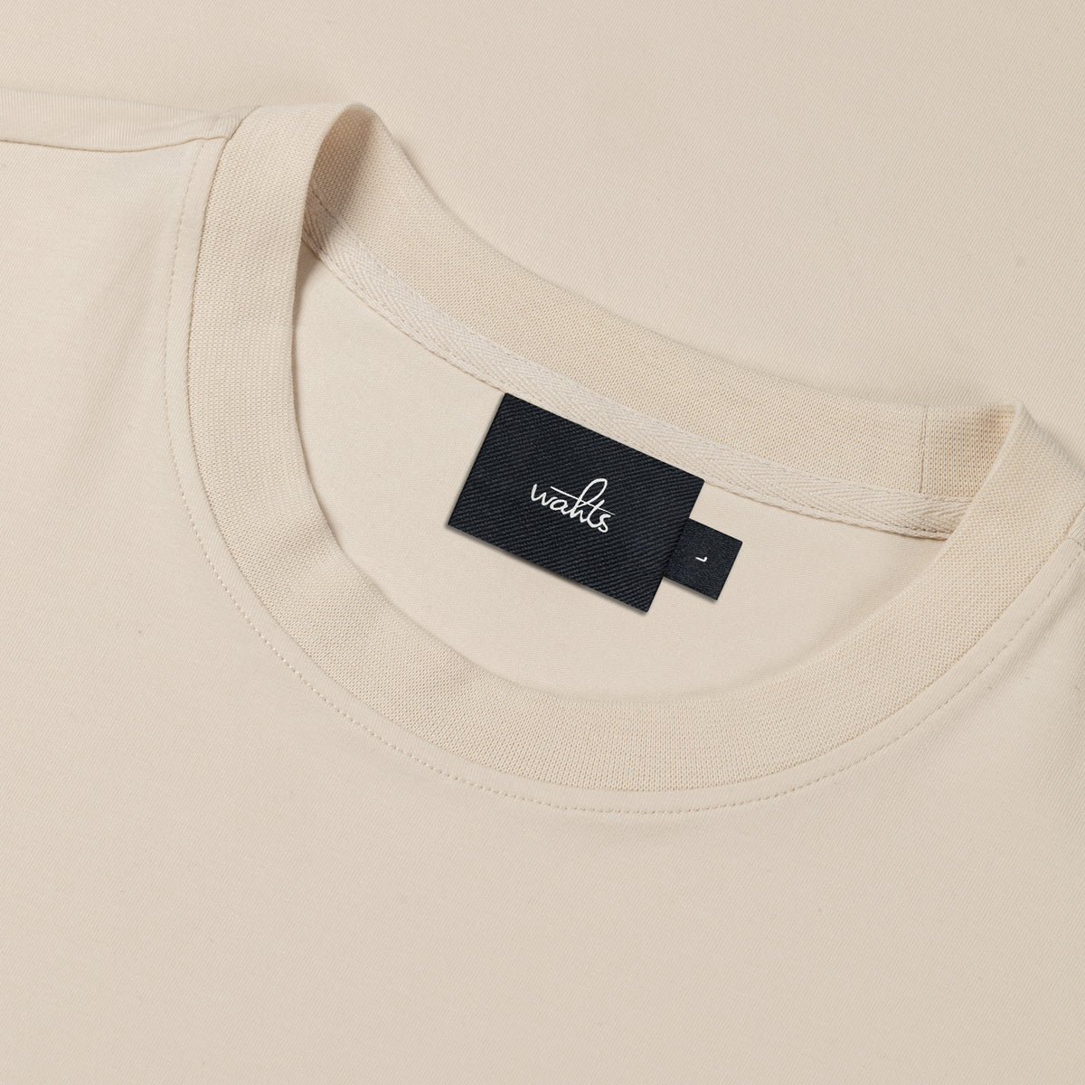 Winter white jersey stretch t-shirt neckline with black brand label tag