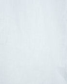 White linen shirt fabric close-up, light textured weave