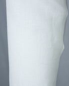 White linen shirt close-up, smooth side panel and sleeve seam