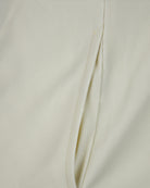 Pale gardenia pin tuck shorts front leg opening with stitched panel and seam