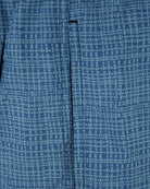 Blue micro-print swimshorts showing center back seam and bar tack