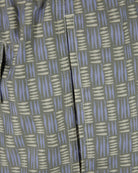 Swimshort seam and side panel close-up, tribal print in grey, lilac, and beige