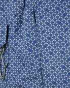 Men's blue swim shorts with micro shark geometric print, pocket eyelets and seam details
