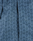 Petrol blue fleur-print swim shorts with center seam detail