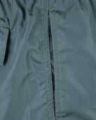Green swim shorts with center seam and stitched fly opening