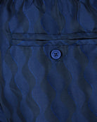 Navy swim short waistband with stitched trim and round logo tag