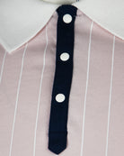 Navy polo placket with white buttons on pale lilac striped fabric