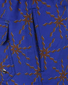Cobalt blue swim shorts with terrazo floral print, side pocket flap and metal snap
