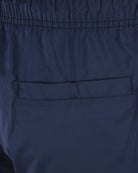 Blue swim shorts with side pocket and contrast-stitched hem