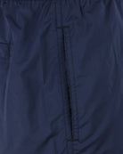 Blue swim shorts with elastic waistband and vertical seam at center