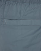 Coastal blue swim shorts fabric with stitched side panel and seam detail