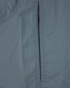 Coastal blue swim shorts with front fly seam and vertical stitching