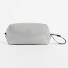 Waterproof wash bag in light gray with wrist strap and geometric logo patch