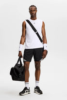 Black athletic shorts with elastic waistband and diagonal striped side insert