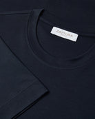 Men's dark navy T-shirt neckline with white ZATtura brand label