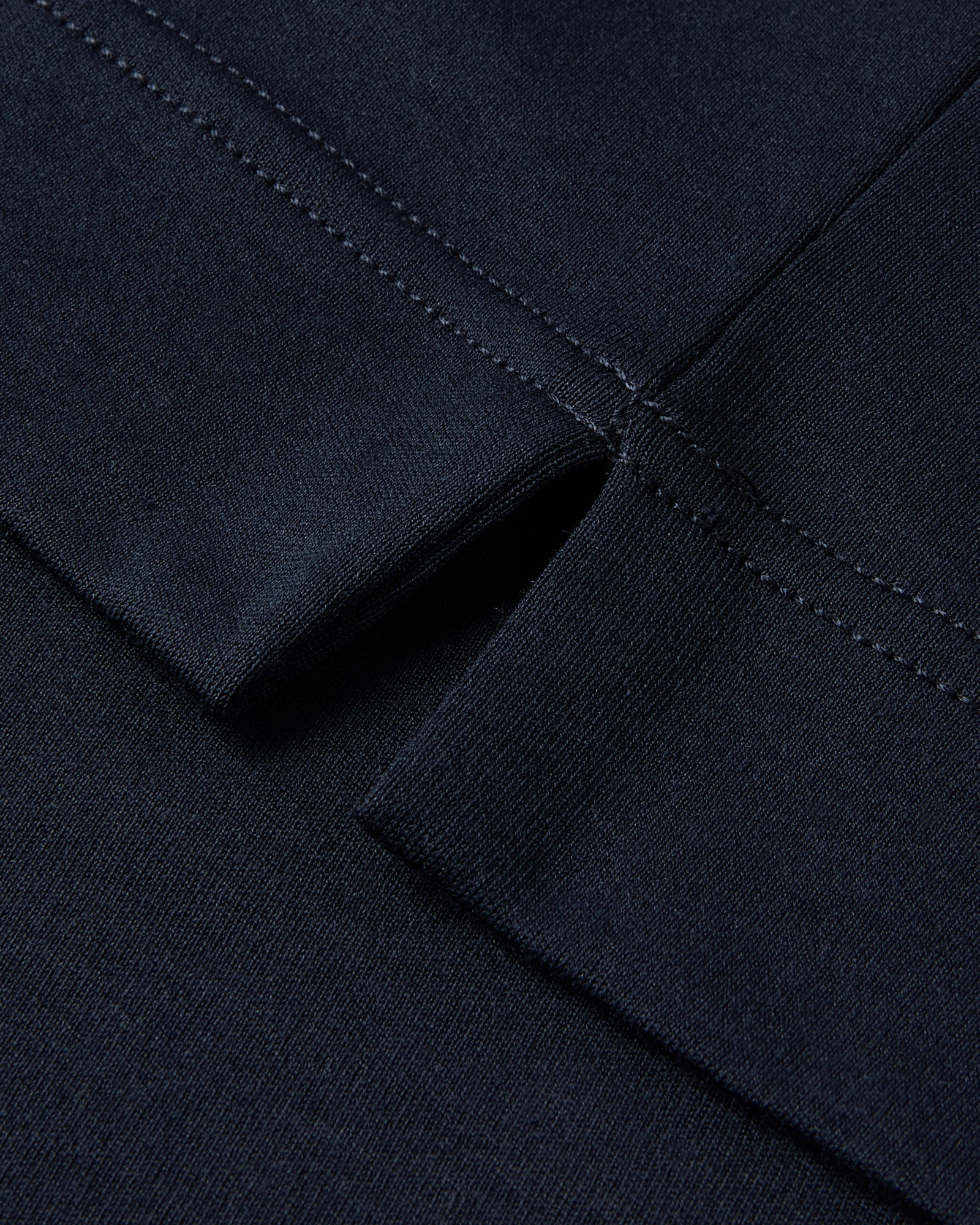 Men's dark navy T-shirt sleeve seam stitching detail