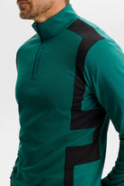 Teal quarter-zip mid layer detail with black side panel and center zipper