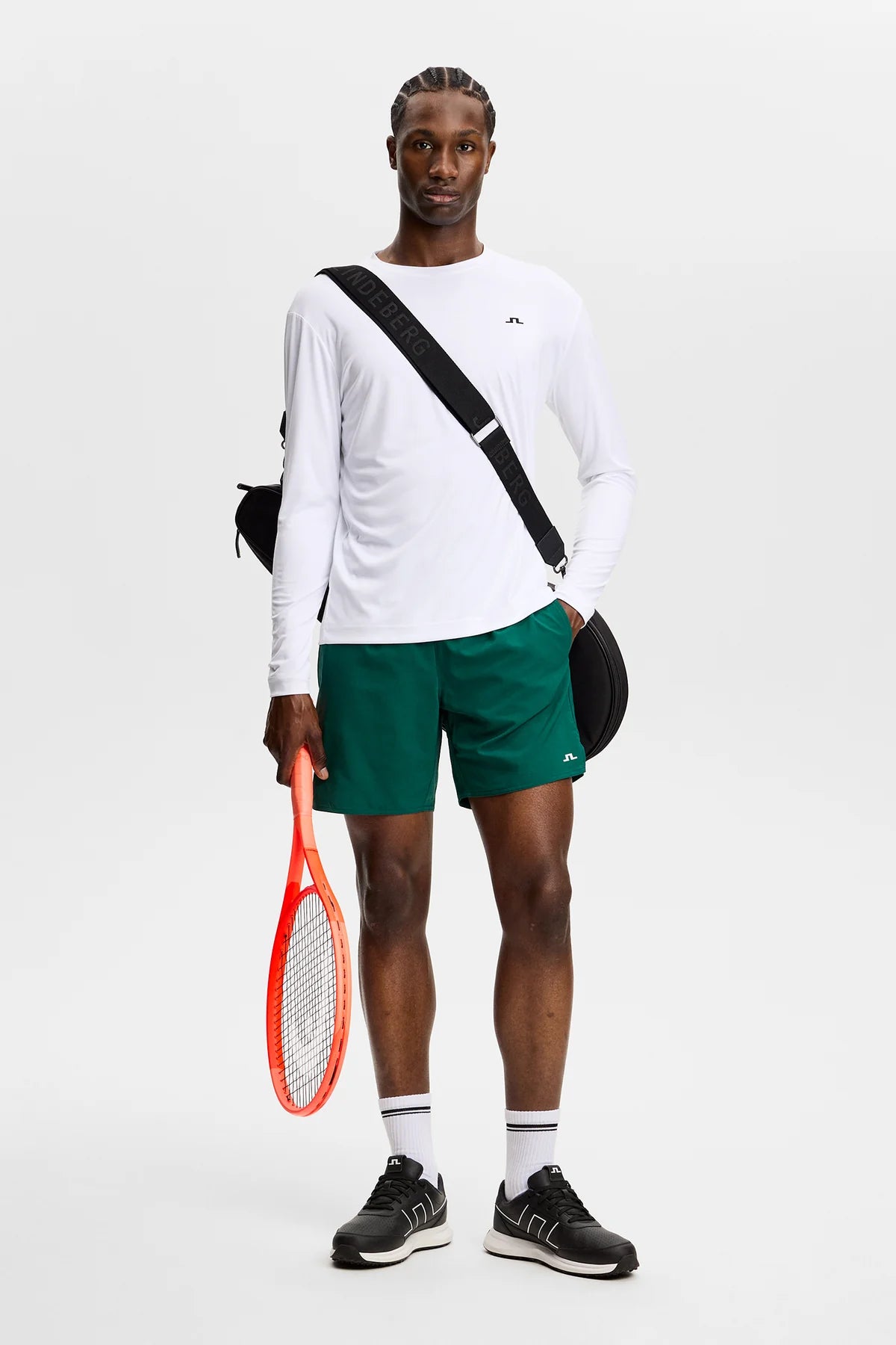 Dark green Preston shorts on model, front view with elastic waistband