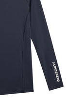 Navy compression top sleeve with vertical logo print and long straight silhouette