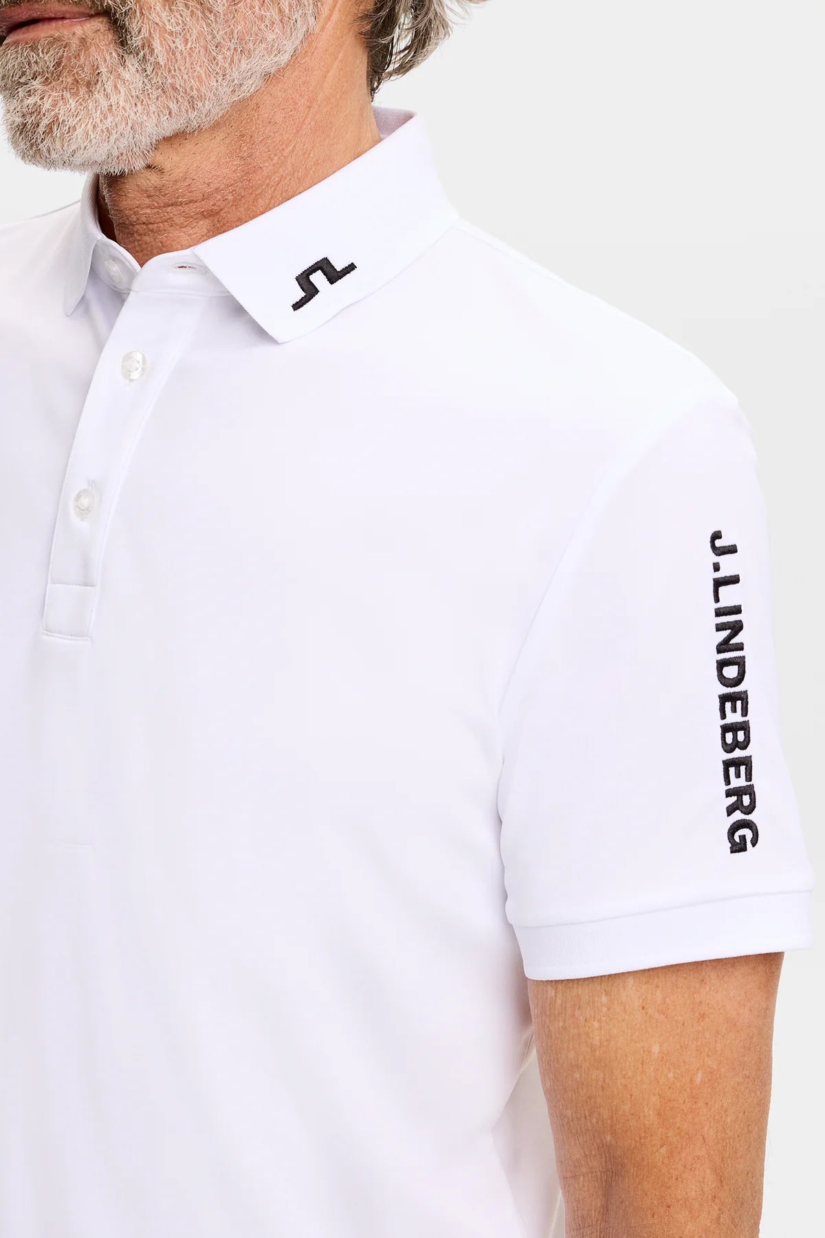 White J.Lindeberg Tour Tech polo collar with button placket and sleeve logo