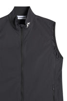 Black packable vest with stand collar, center front zipper, and small logo tab.