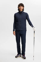 Navy vest with front zipper and stand collar, styled with matching pants