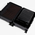 Black cabin suitcase open flat, showing mesh lid and hardshell base compartment