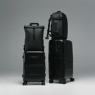 Black cabin suitcase shown with matching hardshell carry-on suitcase set