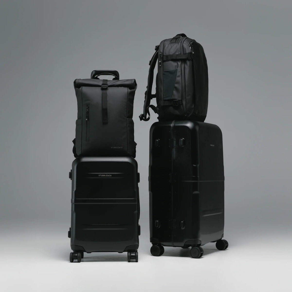 Black cabin suitcase shown with matching hardshell carry-on suitcase set