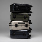 Color lineup of hardshell suitcases with corner locks and spinner wheels